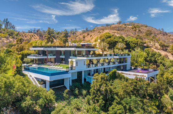 Modern design Los Angeles estate with infinity pool & hillside basketball court.