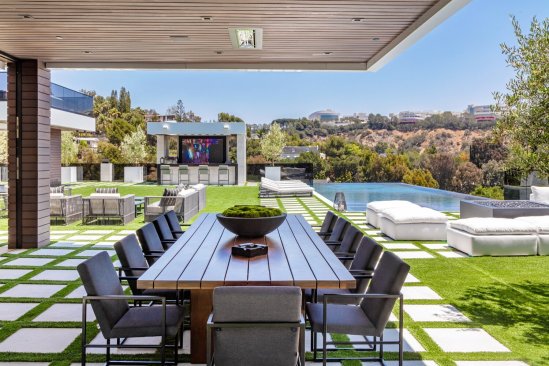 Modern resort style Los Angeles home outdoor covered dining terrace.