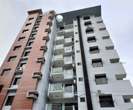 Exterior Facade with Local Brick, Concrete and Painted- Plastered Wall