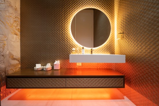 Serenity Indian Wells luxury desert mansion modern guest bathroom powder room with colored indirect LED lighting