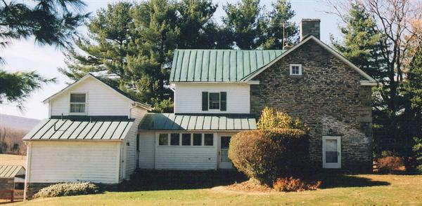 Architect Anne Decker retained the rambling nature of the original farmhouse but gave the new elevation some punch.