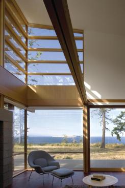 Cedar louvers outside the living room filter the high southern sunlight.