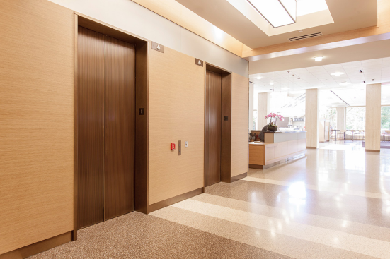 Elevator transoms in ViviChrome Chromis glass with Taupe interlayer and Opalex finish; custom elevator door skins at Lloyd Center Tower, Portland, Oregon
