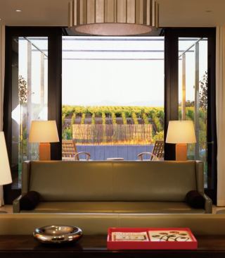 The wine-tasting room offers a vineyard view.