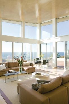 Inspired by the slope of the dunes, the home's rooflines fit elegantly into the site and soar upward to capture distant ocean vistas.