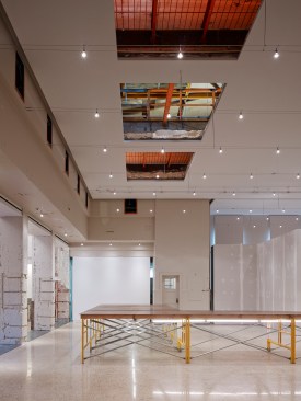 A+detail+of+the+main+gallery+showing+the+skylight+%e2%80%9cghosts%e2%80%9d+and+the+security+catwalk.+An+exhibition+is+being+installed.