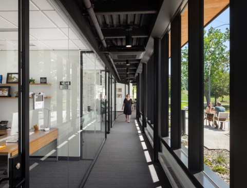 arge windows open views to the surrounding landscape.