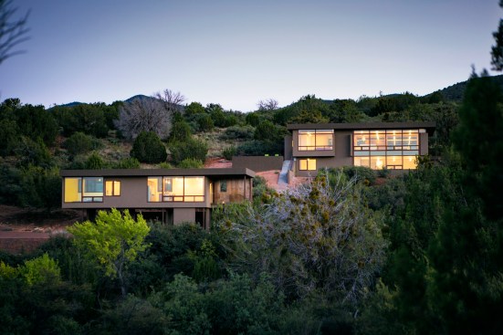 View of main house and guest house with stables