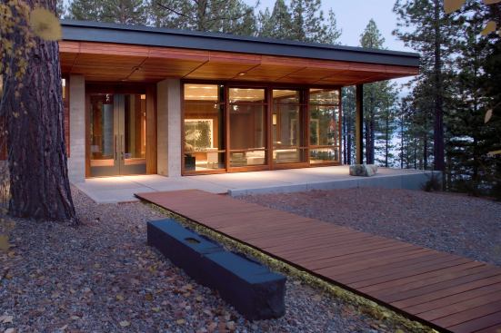 Guest house entry. The two-pavilion composition fits the scale of its environment better than a single larger building.