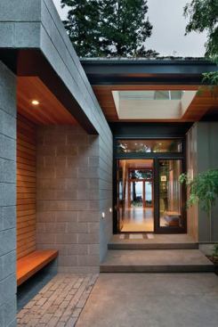 A large cutout in this entryway’s ceiling leaves the emphasis on inviting nature in—a fitting message for this LEED-Platinum home that focuses heavily on recycled materials and green features. Project: Ellis Residence, Bainbridge Island, Wash.; Architect: Coates Design Architects, Bainbridge Island; Builder: Smallwood Design and Construction, Bainbridge Island