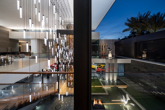 Serenity Indian Wells mansion with luxury open plan display car garage, modern art & lighting design