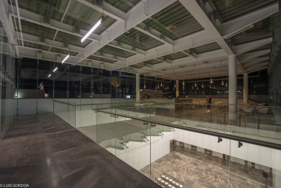 Glass box, night.