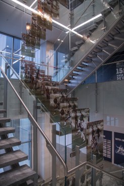 Panels adorning the staircase at the Star pay homage to defining moments in Cowboys football history