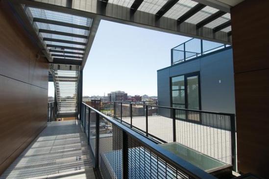 The sculptural fire escape loosens the buildings planes and volumes. 