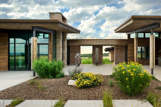 Exterior, horizontal, looking north at breezeway and patios between main house and guest house, Earth Wall II, Squirrel, Idaho; Ward + Blake Architects