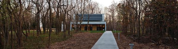 The building was placed facing directly south to maximize solar heat gain in the winter and to maximize power production from photovoltaic panels.