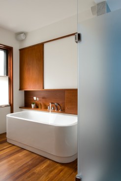 Bathtub with closed sliding cabinet