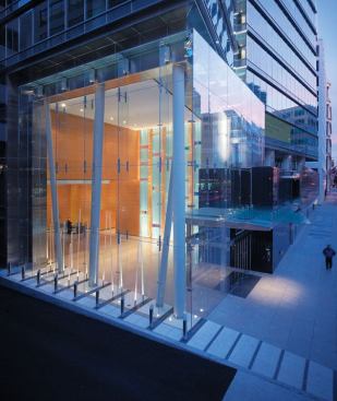The lightbox lobby receives abundant natural light during the day and is visible from blocks away at night.