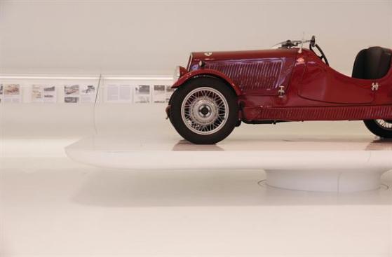 Each+car+sits+on+a+custom-designed+podium%2c+allowing+it+to+hover+over+the+ground+plane.