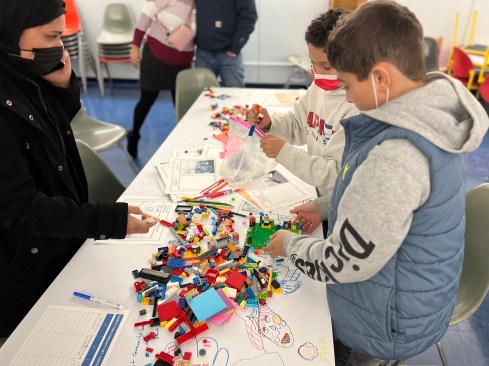 Resident and his child take in the views while sitting on the work. 