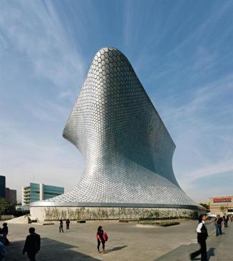 Defined by its mushroomlike form and its skin of locally sourced hexagonal aluminum tiles, the Museo Soumaya is located in the Plaza Carso?developed by billionaire Carlos Slim and largely designed by his son-in-law, architect Fernando Romero.