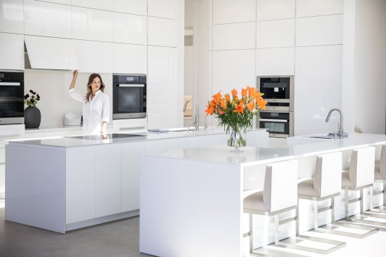 All white modern luxury kitchen featuring Poliform and Miele brands in Beverly Hills home.