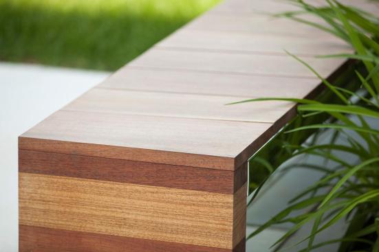 Duo Bench shown with Polished Stainless Steel frame and FSC 100% Jatoba hardwood slats and end at 80 Williams Street, Wellesley, Massachusetts