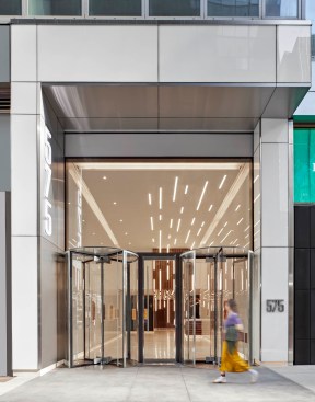 The heavy stainless transom above the revolving doors has been replaced by a 9-foot-tall by 17-foot-6-inch long glass surround.