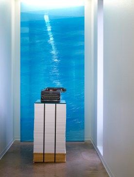 The training room palette of materials includes recycled toner cartridges suspended from the structure.  Aluminum bubble wrap provides a glistening wall surface.  30’ wide sliding doors separate the training room from the café.