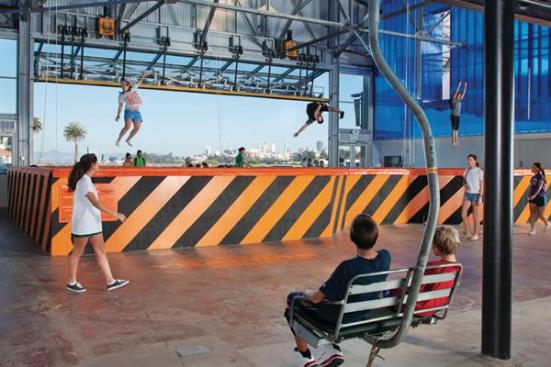 Skilift chairs suspended from catwalk.