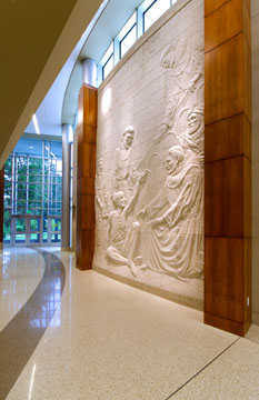 A+cast+stone+relief+mural+conveys+the+Biblical+story+of+St.+Francis+and+the+lepers.