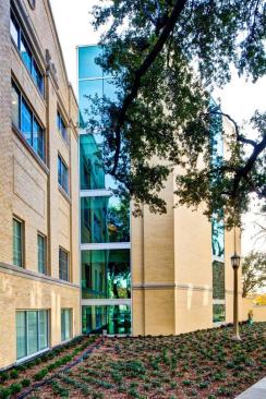 Addition to builidng features glass curtain walls and dramatic vistas