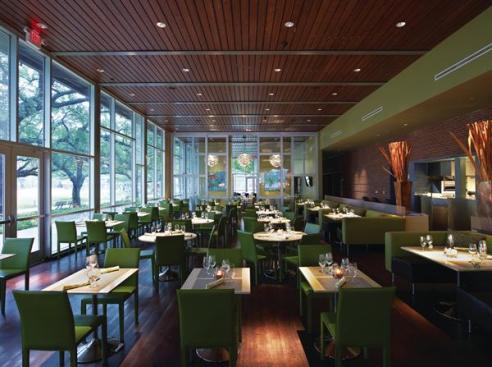 The main dining room uses a wood floor and ceiling, similar to the second-floor dining space. Expanses of glazing allow diners to enjoy views of the new downtown park while feasting on American fare ranging from salad and sandwiches to local seafood. Beyond the interior glass wall are two smaller dining spaces (denoted by the Louis Poulsen artichoke lighting fixtures) that can be closed off for private parties. The interiors were designed by a team from Schiller Del Grande Restaurant Group, the company that runs The Grove, in an effort to give the restaurant the same feel as the company?s other properties.