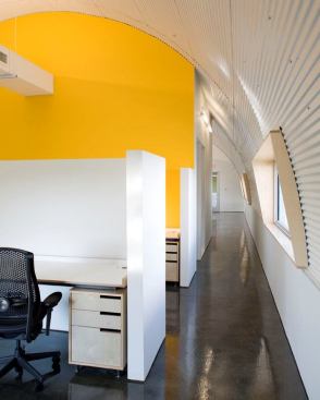 Light and color accentuate the inherent qualities in the architecture. Simple lighting products coordinate with the architecture to offer a cost effective and energy efficient solution.