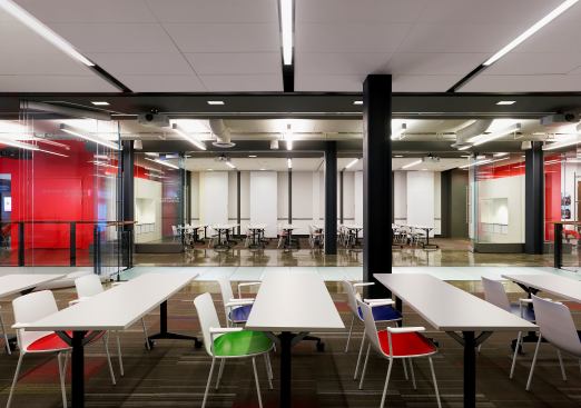 The ground-level seminar room feature movable glass walls and can be reconfigured to accomodate a series of events.