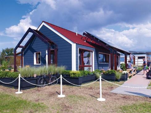 The 4D Home incorporates a divided layout, much like a traditional New England home, and features a gabled roof and exposed beams.