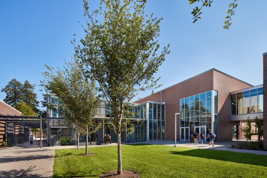 The existing courtyard is now a secure space featuring outdoor learning areas and a Peace Garden.