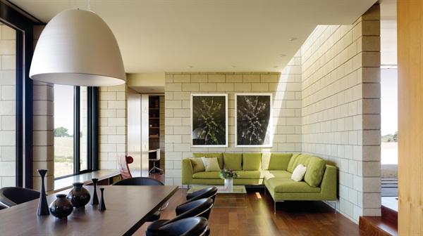 Sandblasted concrete block becomes both an interior and exterior finish material.