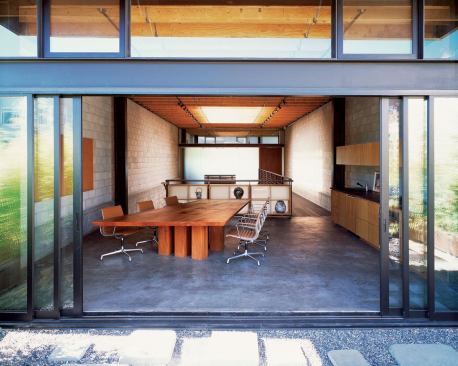 The kitchen/conference room opens to an outdoor terrace, as does the studio across the atrium.