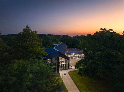 The addition meets the historic house with a light touch.