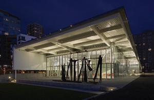 Outside, quartz halogen fixtures uplight the building's canopies for a soft glow.