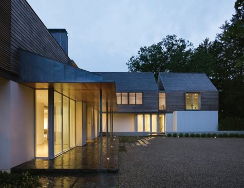 Another gap, partially expressed through a void in the roof massing, separates the garage and guest room from the children's bedrooms.