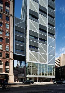 A four-story bridge cantilevers off the new building and connects with the existing Pupin Physics Laboratory next door. Additional bridges on the south face connect to Chandler Laboratories, farther down Broadway.