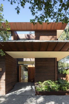 Using the reclaimed Eucalyptus from the felled trees on the property and vintage hardware, Conner + Perry were able to create a stunning custom double pivot door and a private, yet soft, entryway.