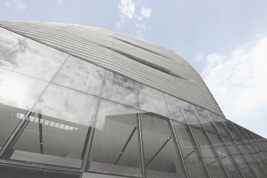 Aluminum+fins+clad+the+exterior+of+the+Model+Home+Gallery%27s+upper+floors.