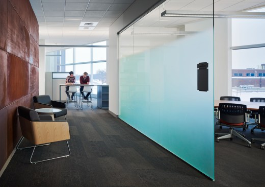 Casual gathering spaces adjacent to the atrium such as this breakout area offer opportunities for interaction.