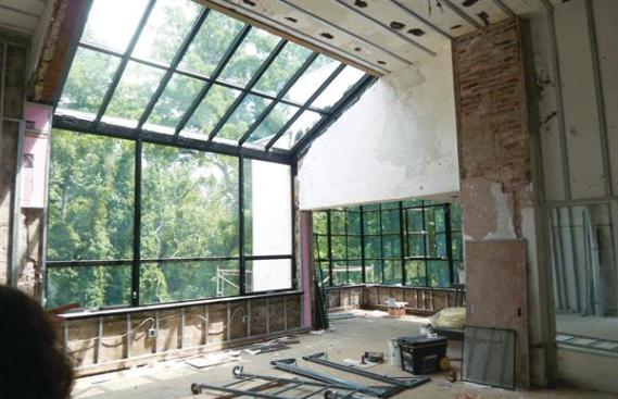 Restoration involved welding new columns around the originals and reinforcing the water-damaged chicken-wire floor deck with steel.