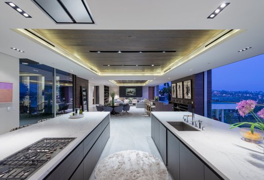 Modern Hollywood Hills home outdoor terrace fireplace with downtown LA views.