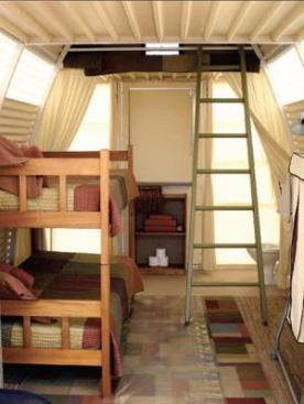 Abod's arched shape allows enough interior height for bunk beds and a sleeping loft.