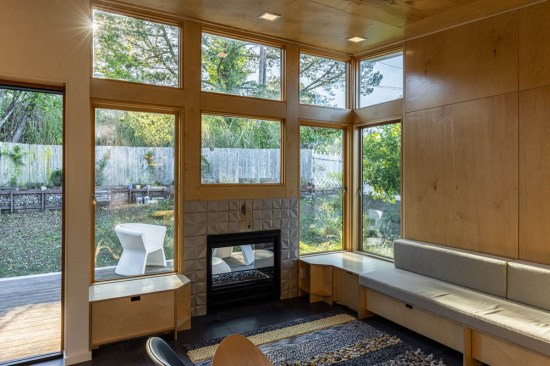 The new sitting area shares a two-sided fireplace with the patio.